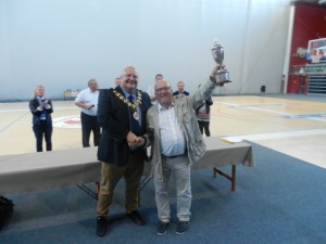 Deputy Mayor Neil Rix relinquishes the Cup to Monsieur Francis Devin, Councillor Delegate to Sport